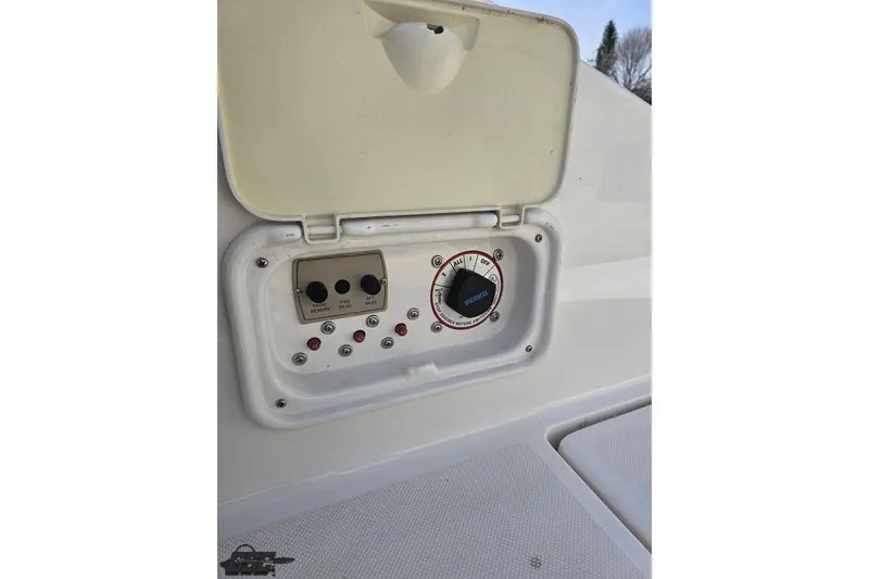 Slide: The Image of Control panel of a 2008 Regal 2520 FasDeck boat with switches and dials. - 106
