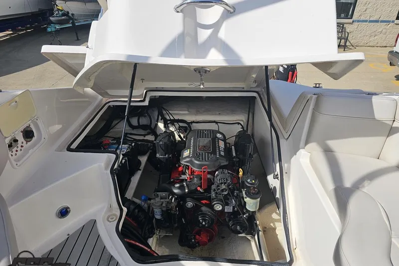 Slide: The Image of 2008 Regal 2520 FasDeck boat engine compartment with open hatch, showcasing engine details. - 107