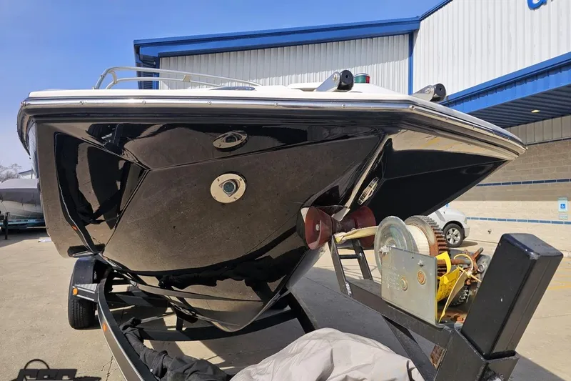 Slide: The Image of 2008 Regal 2520 FasDeck boat on trailer, parked outside a building. - 19