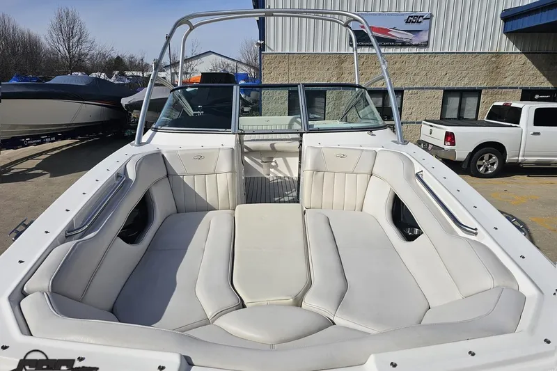 Slide: The Image of 2008 Regal 2520 FasDeck boat with spacious white seating and sleek design. - 21