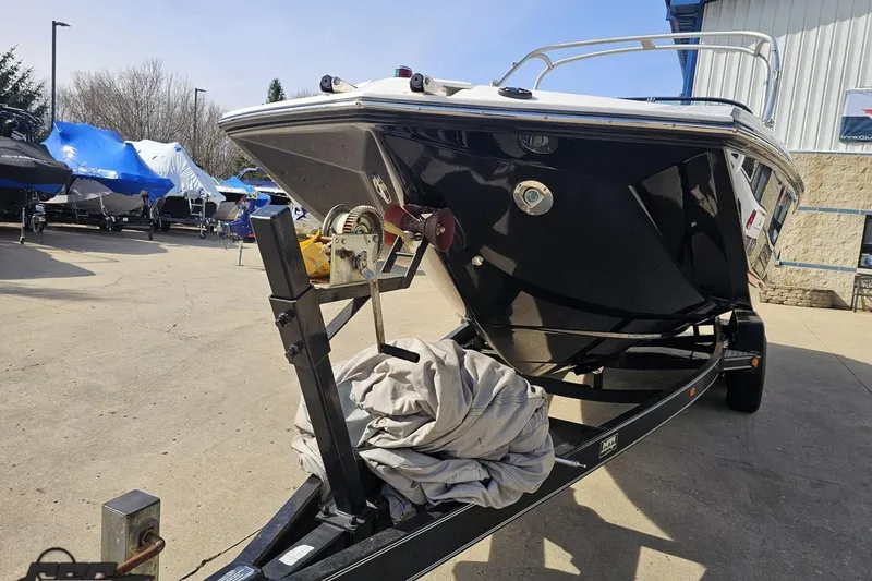 Slide: The Image of 2008 Regal 2520 FasDeck boat on trailer in outdoor storage area. - 22