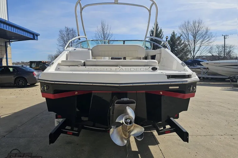 Slide: The Image of 2008 Regal 2520 FasDeck boat, rear view, parked outdoors on a sunny day. - 36