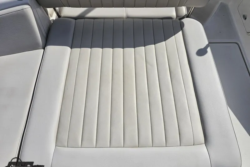Slide: The Image of White leather seating on a 2008 Regal 2520 FasDeck boat. - 42