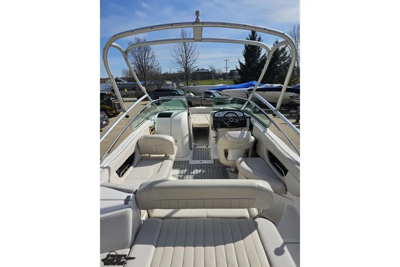 Slide: The Image of 2008 Regal 2520 FasDeck boat interior with white seating and steering console. - 43