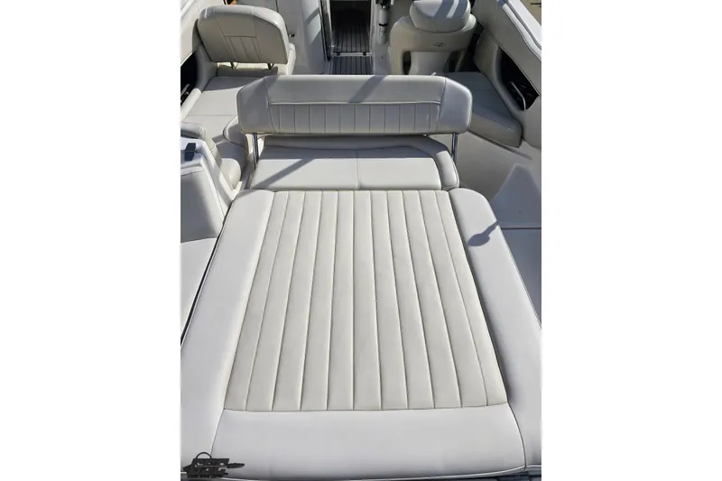 Slide: The Image of 2008 Regal 2520 FasDeck boat interior with white cushioned seating. - 45