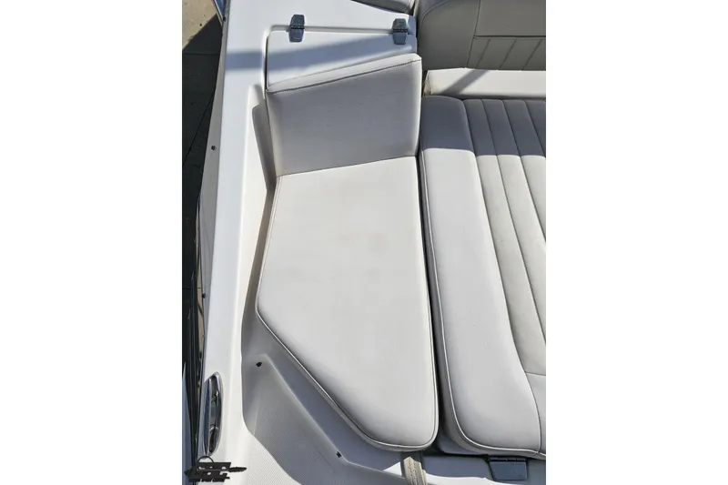 Slide: The Image of 2008 Regal 2520 FasDeck boat seating with white upholstery and sleek design. - 47