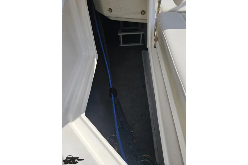 Slide: The Image of Interior view of a 2008 Regal 2520 FasDeck boat, showing seating and wiring. - 48