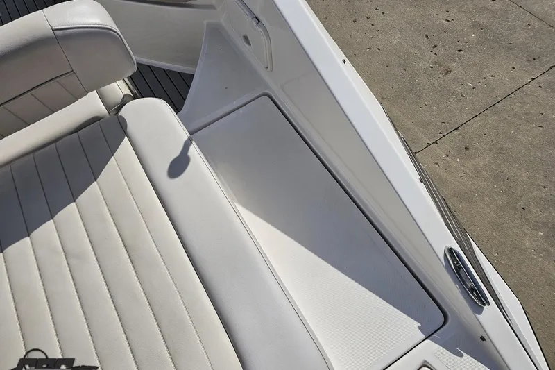 Slide: The Image of 2008 Regal 2520 FasDeck boat interior with white seating and deck details. - 49