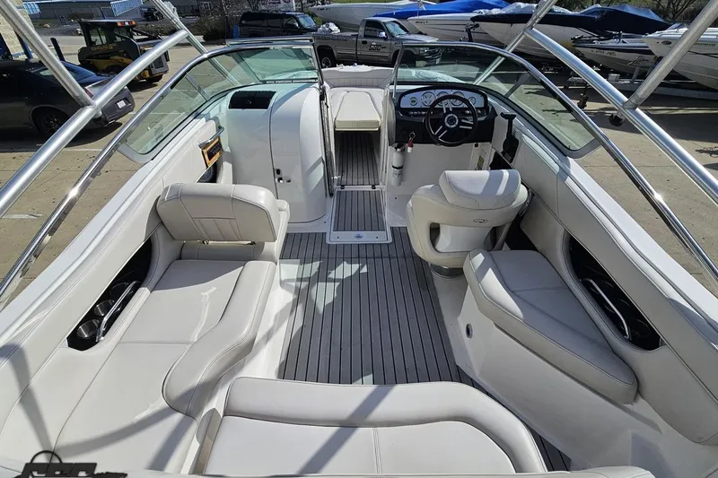 Slide: The Image of 2008 Regal 2520 FasDeck boat interior with white seating and modern dashboard. - 51