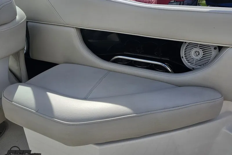 Slide: The Image of 2008 Regal 2520 FasDeck boat interior with cushioned seating and speaker detail. - 54