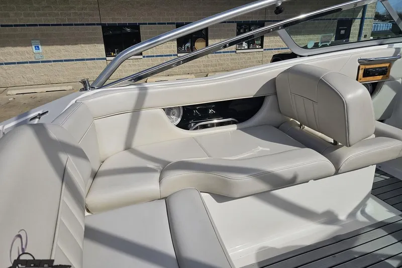 Slide: The Image of 2008 Regal 2520 FasDeck boat interior with white leather seating and sleek design. - 56
