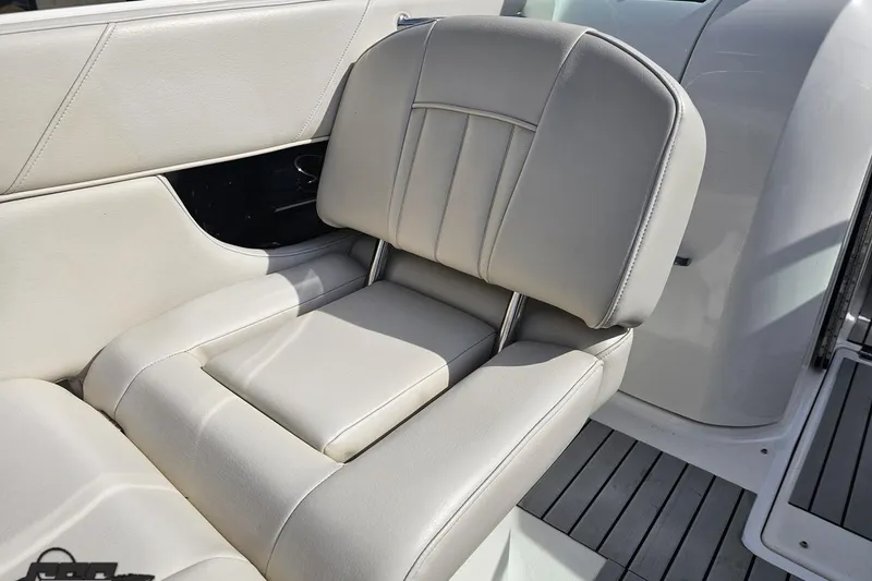 Slide: The Image of Luxury seating on a 2008 Regal 2520 FasDeck boat, featuring sleek white upholstery. - 59