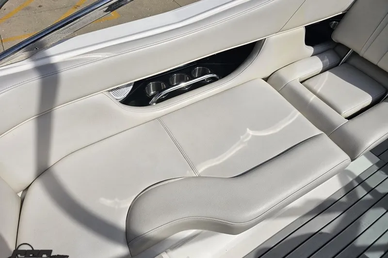 Slide: The Image of Luxurious seating on a 2008 Regal 2520 FasDeck boat with integrated cup holders. - 60