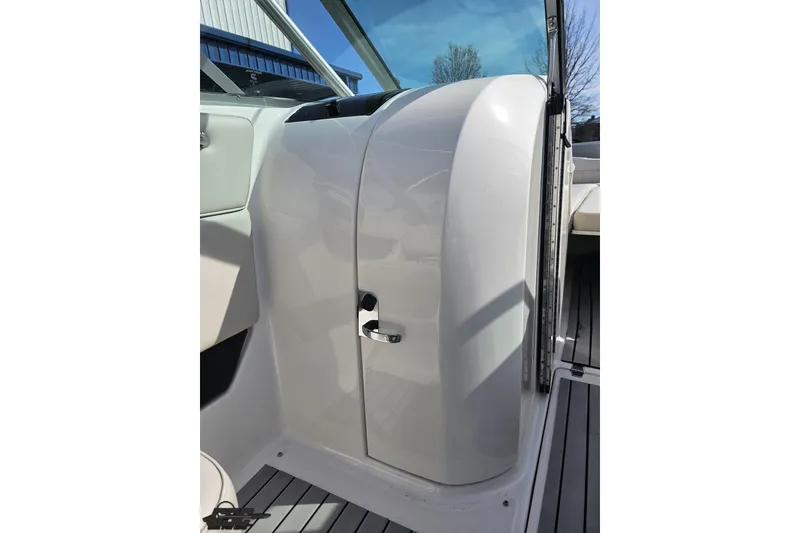 Slide: The Image of 2008 Regal 2520 FasDeck boat interior with sleek white console and modern design. - 66
