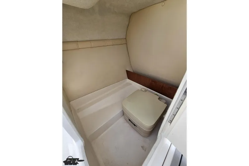 Slide: The Image of Interior of 2008 Regal 2520 FasDeck boat featuring compact marine toilet. - 68