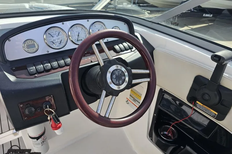 Slide: The Image of Steering wheel and dashboard of 2008 Regal 2520 FasDeck boat. - 72