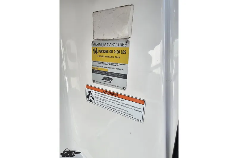 Slide: The Image of 2008 Regal 2520 FasDeck capacity label, maximum 14 persons or 2100 lbs, safety warning. - 78