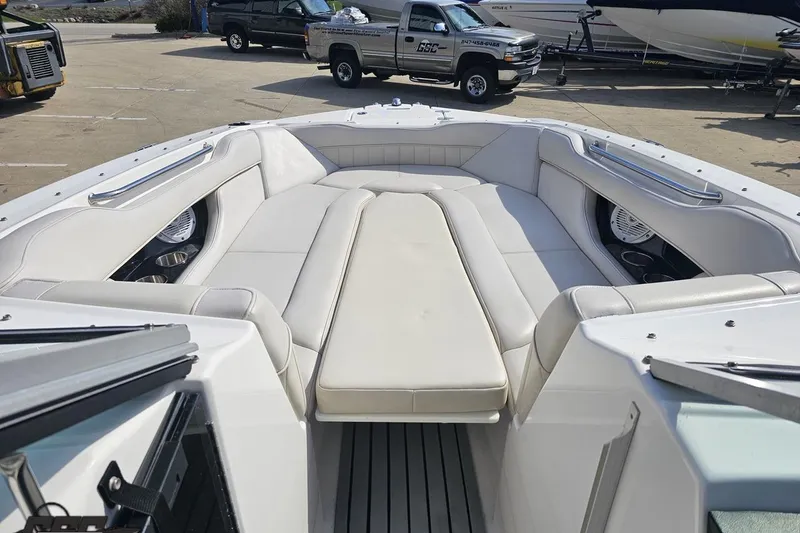 Slide: The Image of 2008 Regal 2520 FasDeck boat interior with white seating and spacious layout. - 85