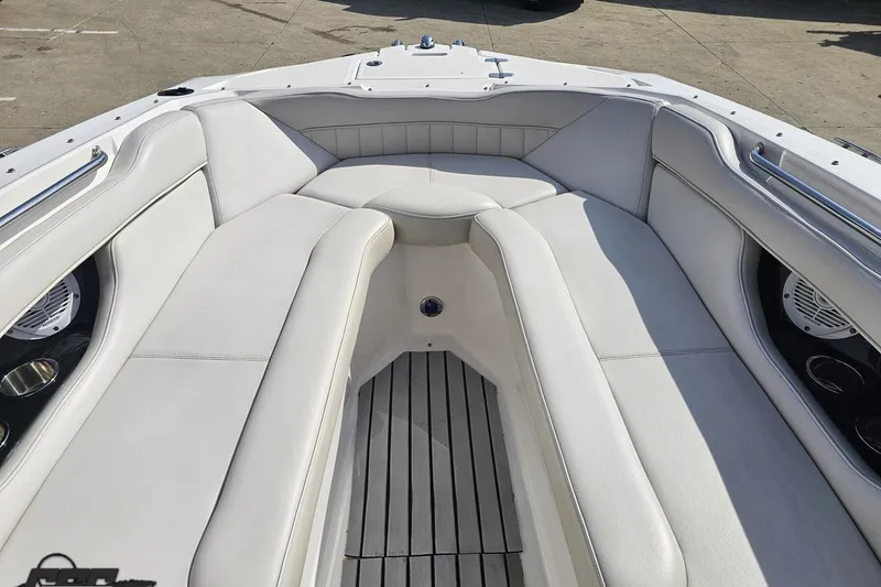 Slide: The Image of Bow seating area of a 2008 Regal 2520 FasDeck boat with white upholstery. - 89