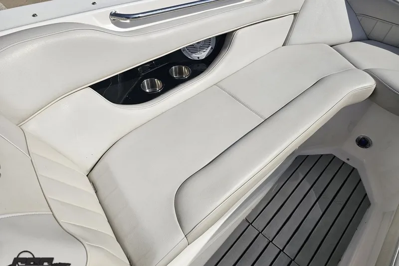 Slide: The Image of Luxurious seating on a 2008 Regal 2520 FasDeck boat with cup holders and sleek design. - 92