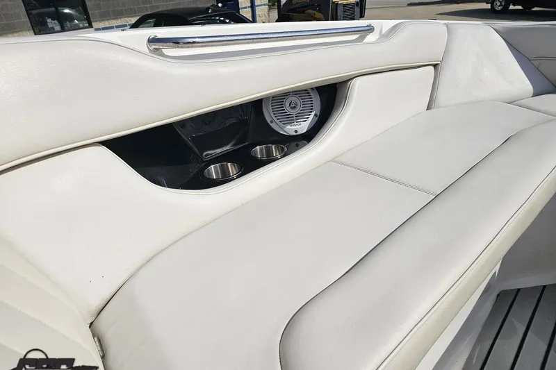 Slide: The Image of 2008 Regal 2520 FasDeck boat interior with white seating and built-in speaker. - 93