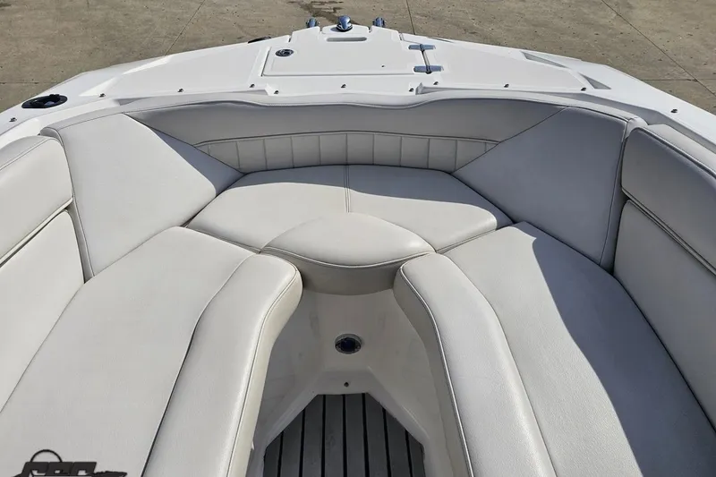 Slide: The Image of 2008 Regal 2520 FasDeck boat interior with white cushioned seating. - 94