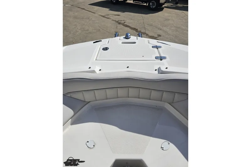 Slide: The Image of 2008 Regal 2520 FasDeck boat interior, featuring white seating and deck details. - 98