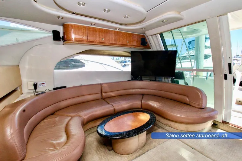 Slide: The Image of Luxurious interior of 2002 Maxum 4600 SCB yacht with curved leather seating and modern amenities. - 12