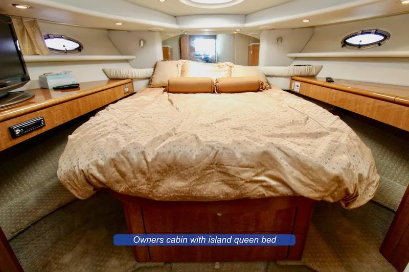 Slide: The Image of Luxurious owner's cabin with island queen bed in 2002 Maxum 4600 SCB Limited Edition yacht. - 15