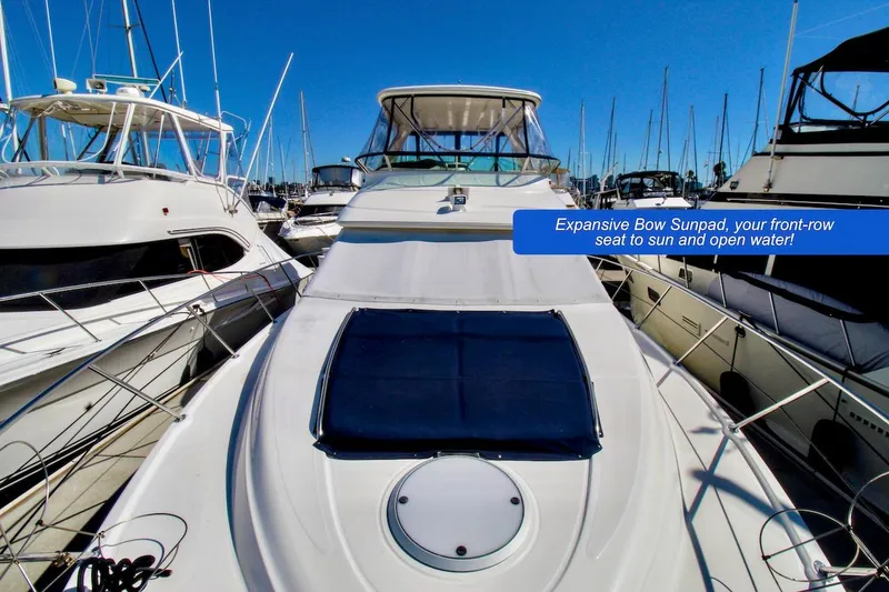 Slide: The Image of 2002 Maxum 4600 SCB Limited Edition yacht with expansive bow sunpad in marina. - 3