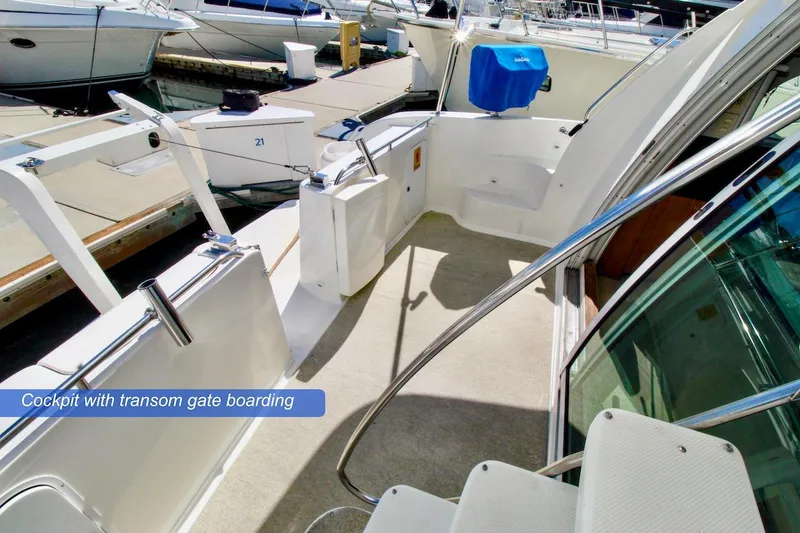 Slide: The Image of Cockpit of 2002 Maxum 4600 SCB Limited Edition with transom gate boarding. - 4
