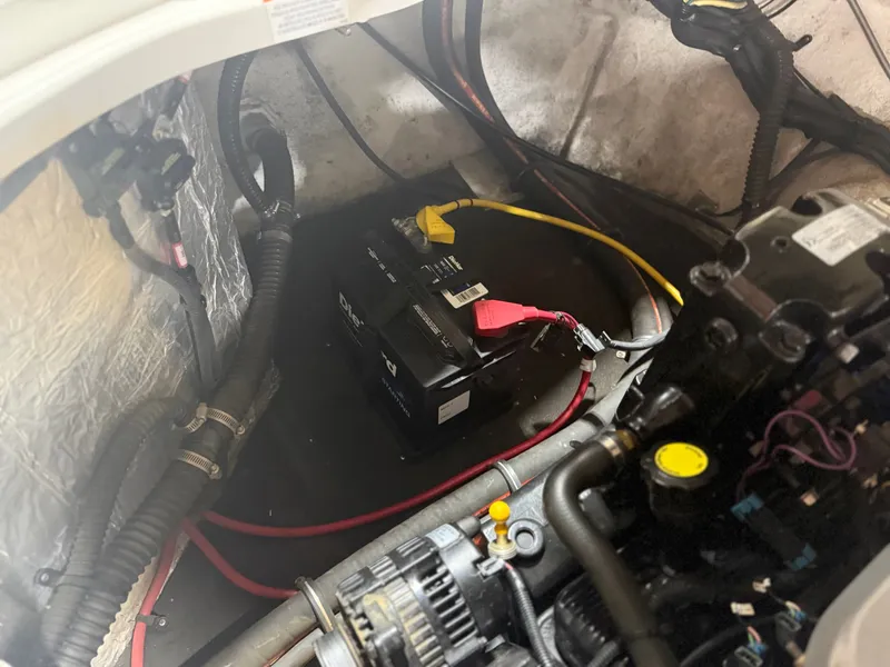 Slide: The Image of Battery in the engine compartment of a 2009 Crownline 240 LS boat. - 12