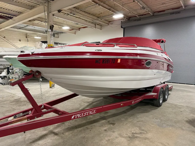 Slide: The Image of 2009 Crownline 240 LS boat on trailer in warehouse. - 3