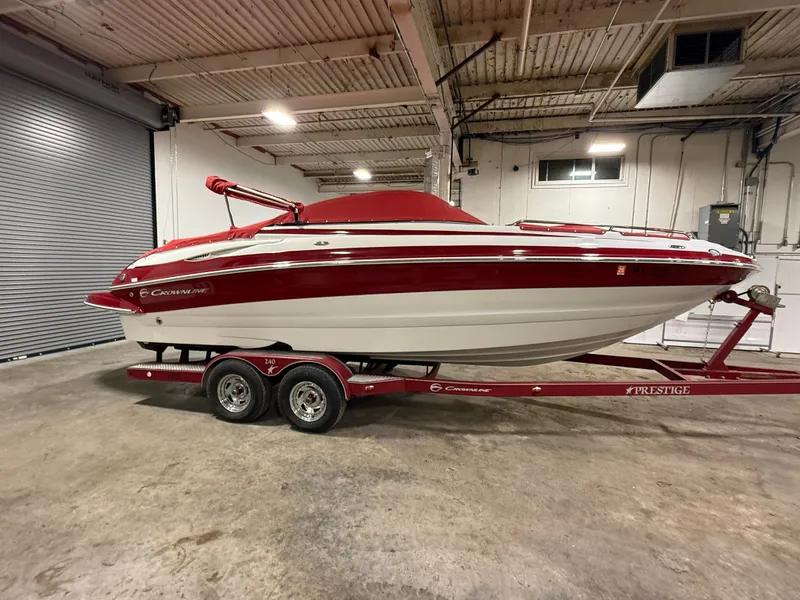 Slide: The Image of 2009 Crownline 240 LS boat in warehouse on trailer. - 4