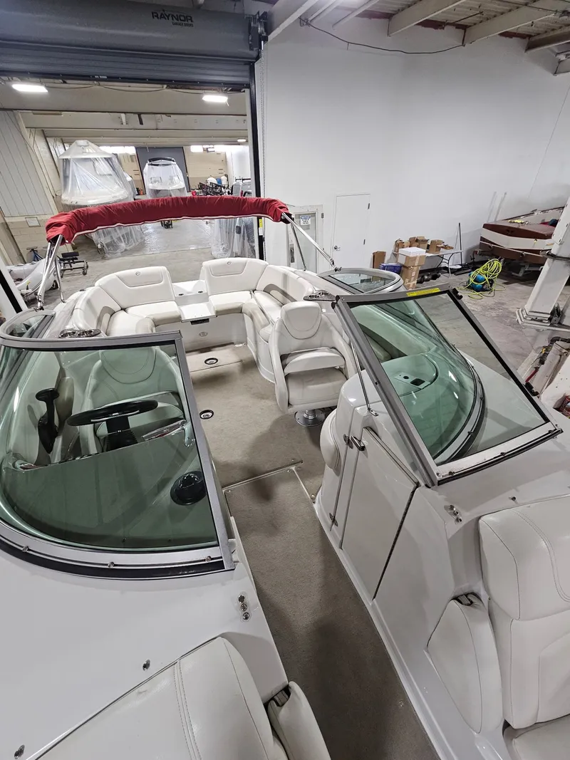 Slide: The Image of Interior view of a 2009 Crownline 240 LS boat in a workshop. - 6