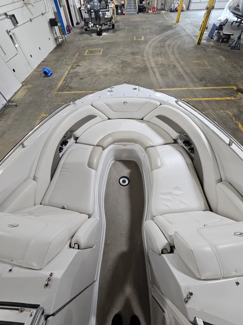 Slide: The Image of Interior view of a 2009 Crownline 240 LS boat with white seating. - 7