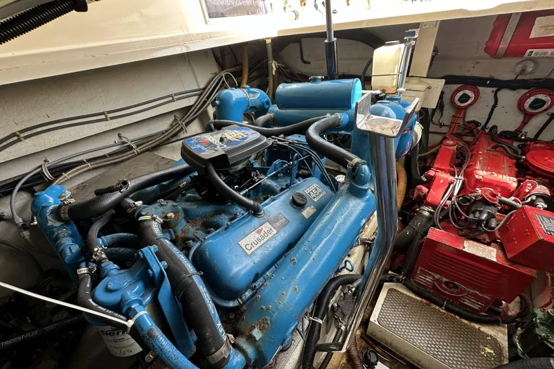 Slide: The Image of Engine room of a 1990 Tiara Yachts 3600 Open, featuring Crusader engines. - 20