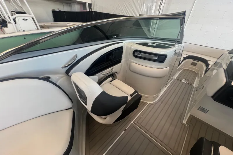 Slide: The Image of 2024 Crownline Eclipse E290 XS boat interior with sleek seating and modern design. - 12