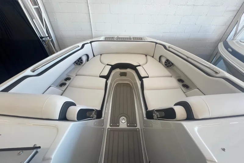 Slide: The Image of 2024 Crownline Eclipse E290 XS boat interior with luxurious white seating and modern design. - 14