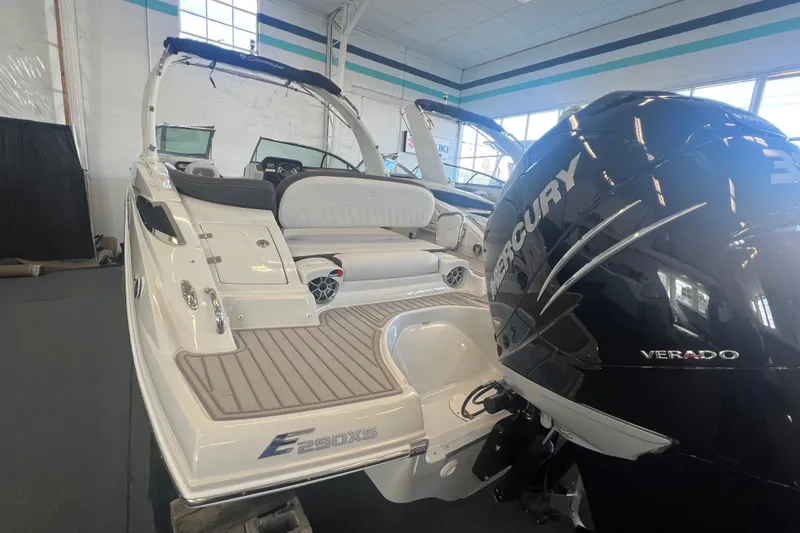 Slide: The Image of 2024 Crownline Eclipse E290 XS boat with Mercury Verado engine in showroom. - 6