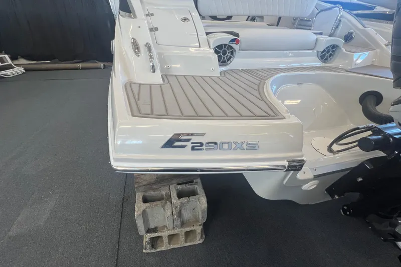 Slide: The Image of 2024 Crownline Eclipse E290 XS boat rear deck with seating and speakers. - 7