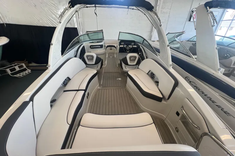 Slide: The Image of 2024 Crownline Eclipse E290 XS boat interior with luxurious seating and modern design. - 9
