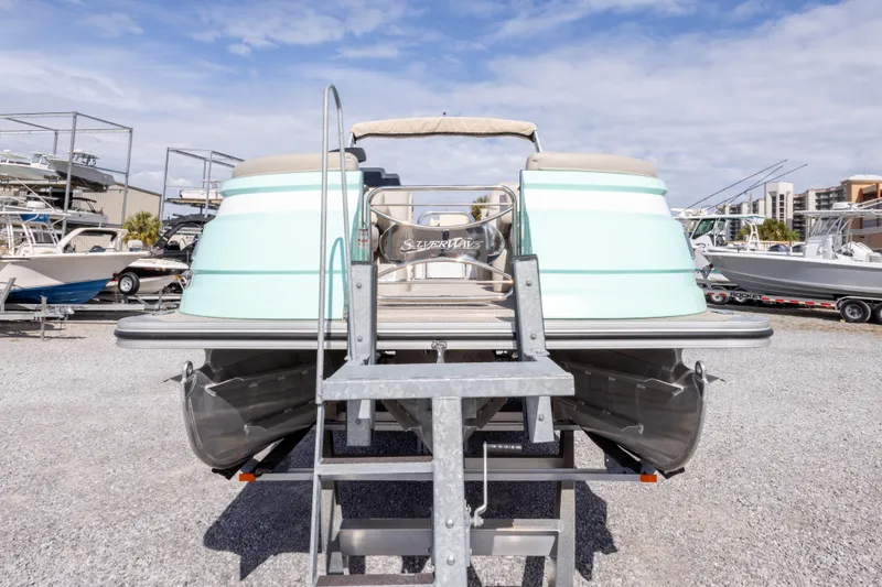 Slide: The Image of 2024 SilverWave 2210 CLS SW5 pontoon boat on trailer, featuring a sleek design and mint green color. - 10