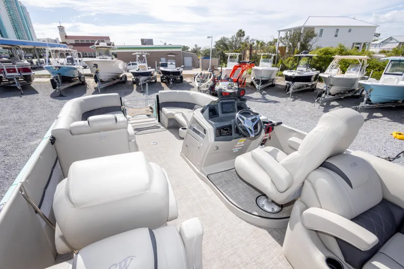 Slide: The Image of 2024 SilverWave 2210 CLS SW5 pontoon boat interior with plush seating and modern dashboard. - 15