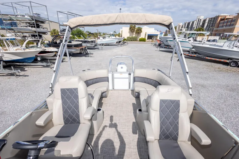 Slide: The Image of 2024 SilverWave 2210 CLS SW5 pontoon boat with luxurious seating and modern dashboard. - 16