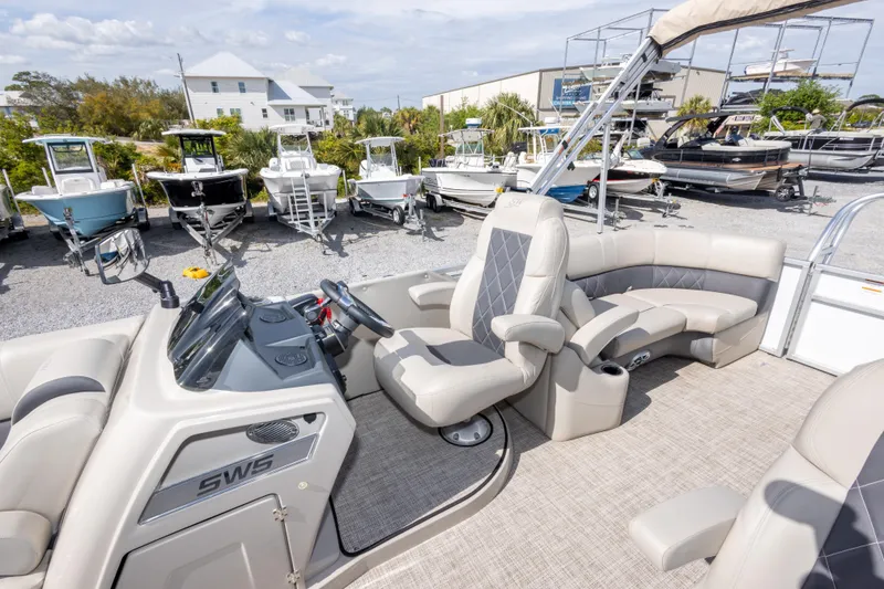 Slide: The Image of 2024 SilverWave 2210 CLS SW5 pontoon boat interior with plush seating and canopy. - 17