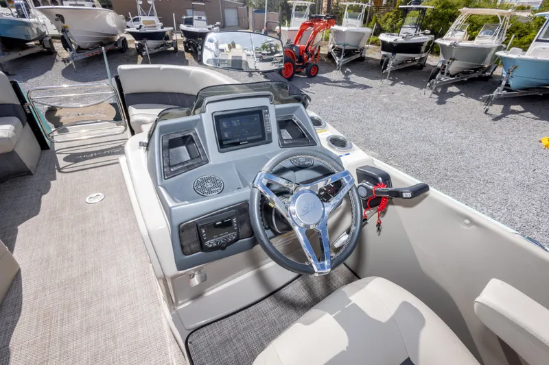 Slide: The Image of Interior view of 2024 SilverWave 2210 CLS SW5 pontoon boat at a marina. - 19