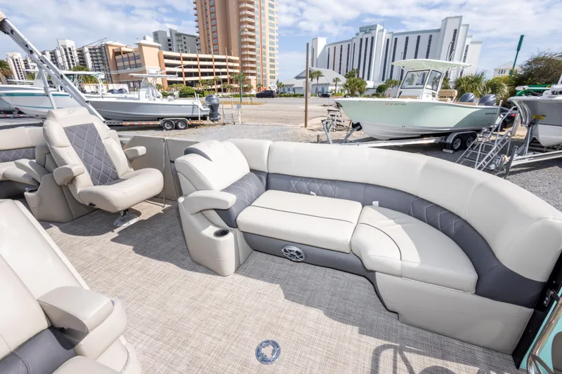 Slide: The Image of 2024 SilverWave 2210 CLS SW5 pontoon boat interior with plush seating and modern helm. - 27