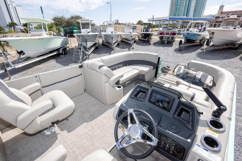 Slide: The Image of 2024 SilverWave 2210 CLS SW5 pontoon boat interior with plush seating and modern design. - 28