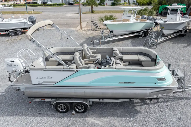 Slide: The Image of 2024 SilverWave 2210 CLS SW5 pontoon boat with spacious seating and sleek design. - 31